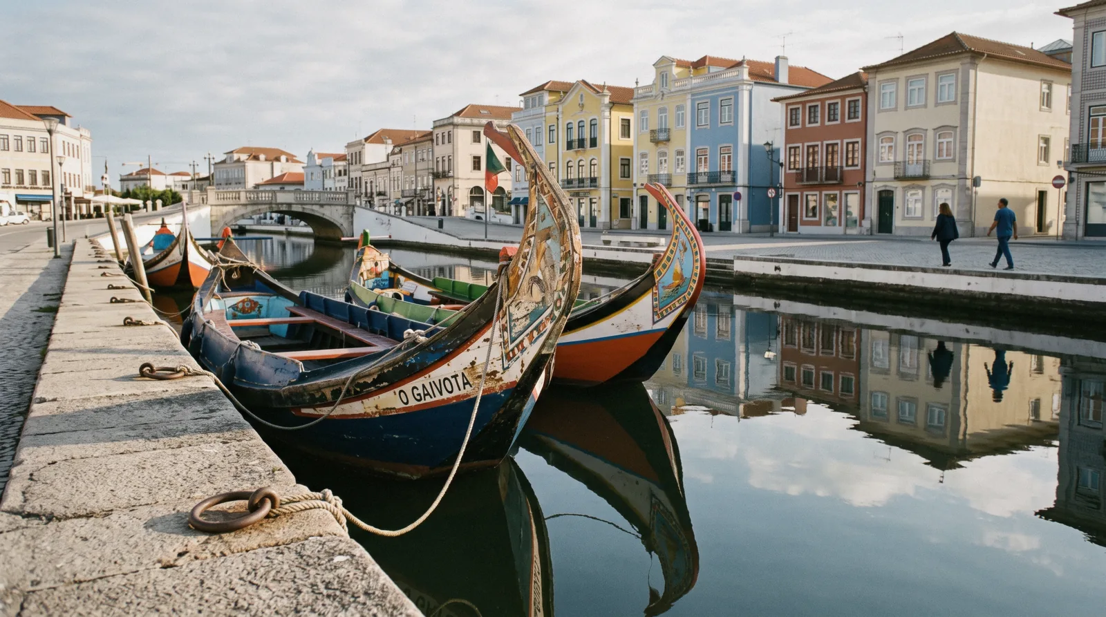 Painted moliceiro boats moored along the central canal in Aveiro, the end of a Porto to Aveiro train day