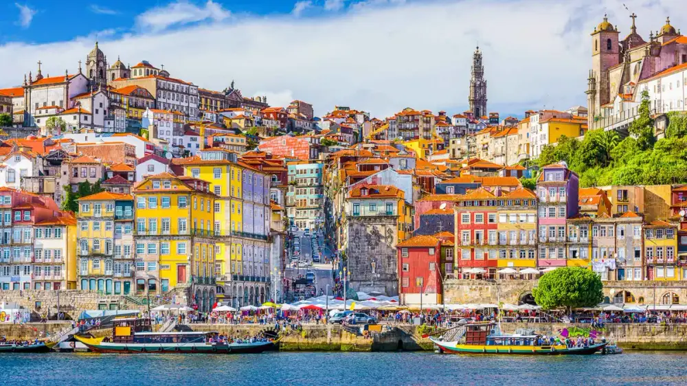 The colourful facades of Ribeira seen from the Douro on a Six Bridges cruise in Porto